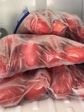 Bags of frozen tomatoes